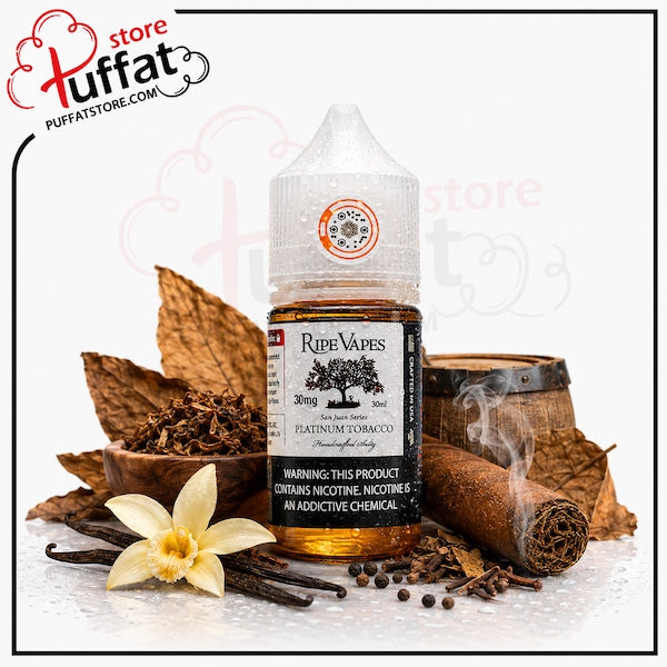 A bottle of Ripe Vapes e-liquid centered on a white background, surrounded by themed props including dried tobacco leaves, a cinnamon stick, cloves, a vanilla flower, and a small wooden barrel. The bottle label reads 'Ripe Vapes' and 'Platinum Tobacco'.