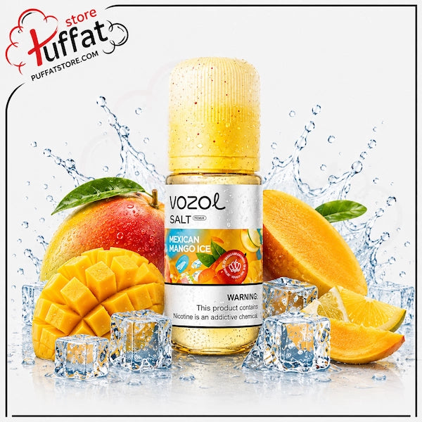 A bottle of Vozol Salt e-liquid in the Mexican Mango Ice flavor, surrounded by fresh mangoes, orange slices, ice cubes, and water splashes on a white background. A 'store puffatSTORE.