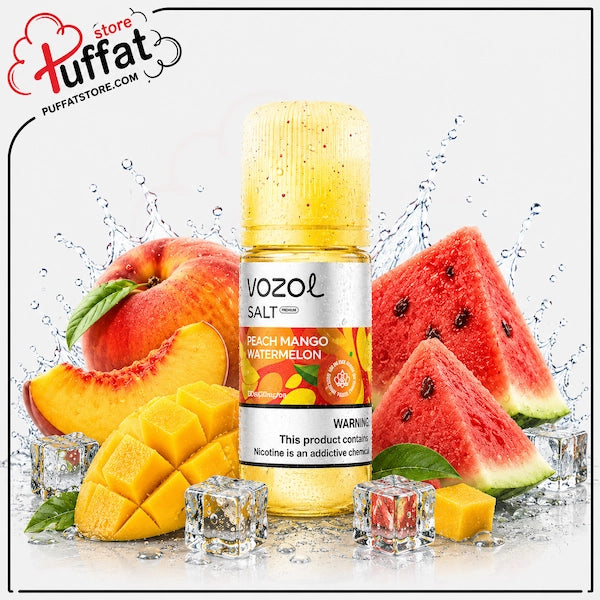A bottle of Vozol Salt Peach Mango Watermelon e-liquid centered on a white background, surrounded by fresh fruit slices and cubes, ice cubes, and water splashes. The Puffat store logo is visible in the top-left corner.