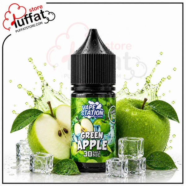Vape Station Green Apple Super Ice Salt 30ml.webp shows a Vape Station Green Apple Super Ice SaltNic vape juice bottle with a black cap, surrounded by a halved green apple revealing its seeds on the left, a whole green apple with glossy green leaves on the right, several clear ice cubes scattered around the base, and dynamic green-tinted liquid splashes on a white background featuring a "Puffat Store" logo in the top-left corner.