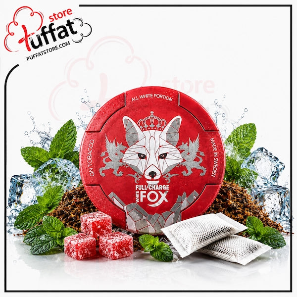 A round red tin of Full Charge by Fox All White Portions candy is displayed with mint leaves, ice cubes, red candy pieces, and two white sachets on a white background. The 'luffat store' logo is visible in the top left corner.